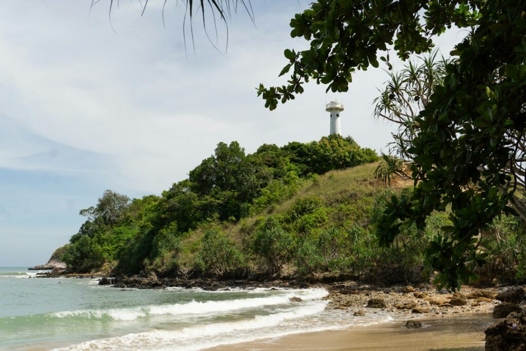 Koh Lanta: A sandy beach with a light house in the distance**