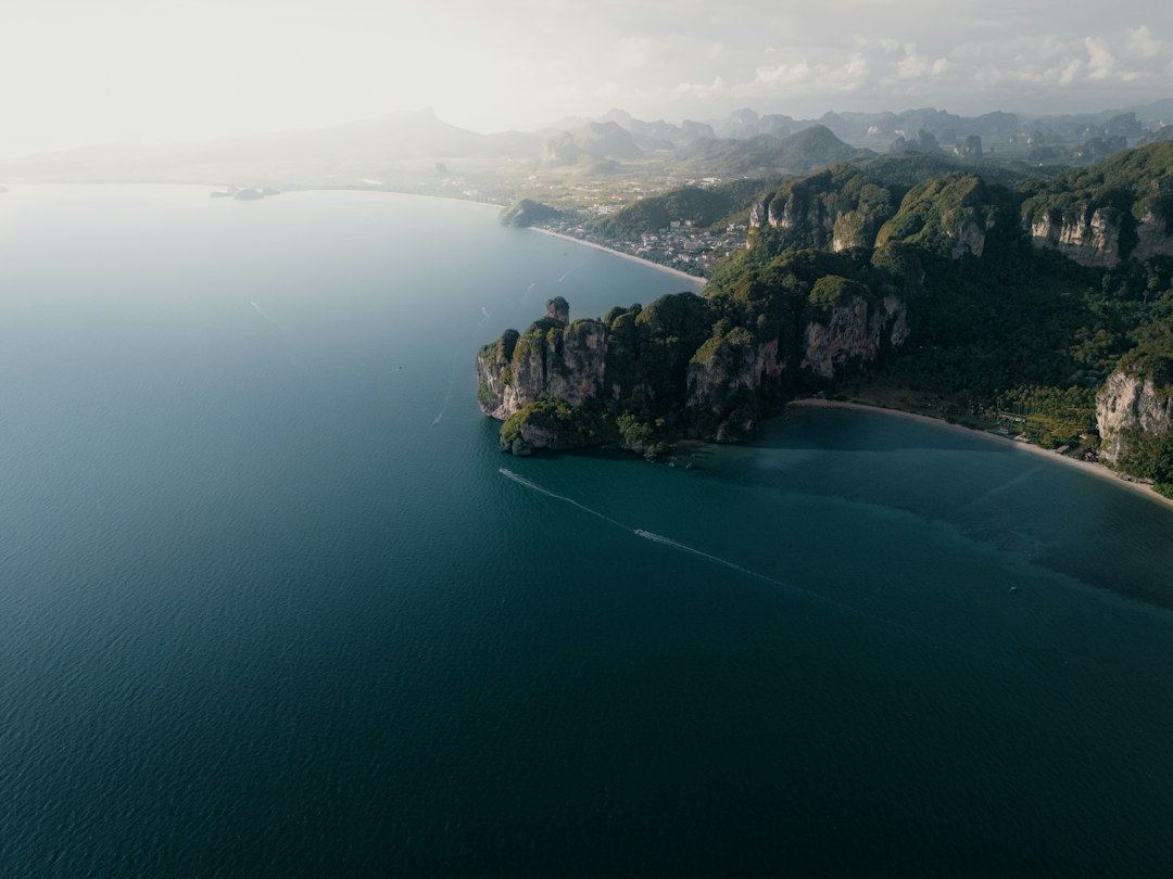 Krabi: Up in the sky’s in Krabi were the sand meets the calm blue sea surrounded by cliffs at Tonsaj Beach**