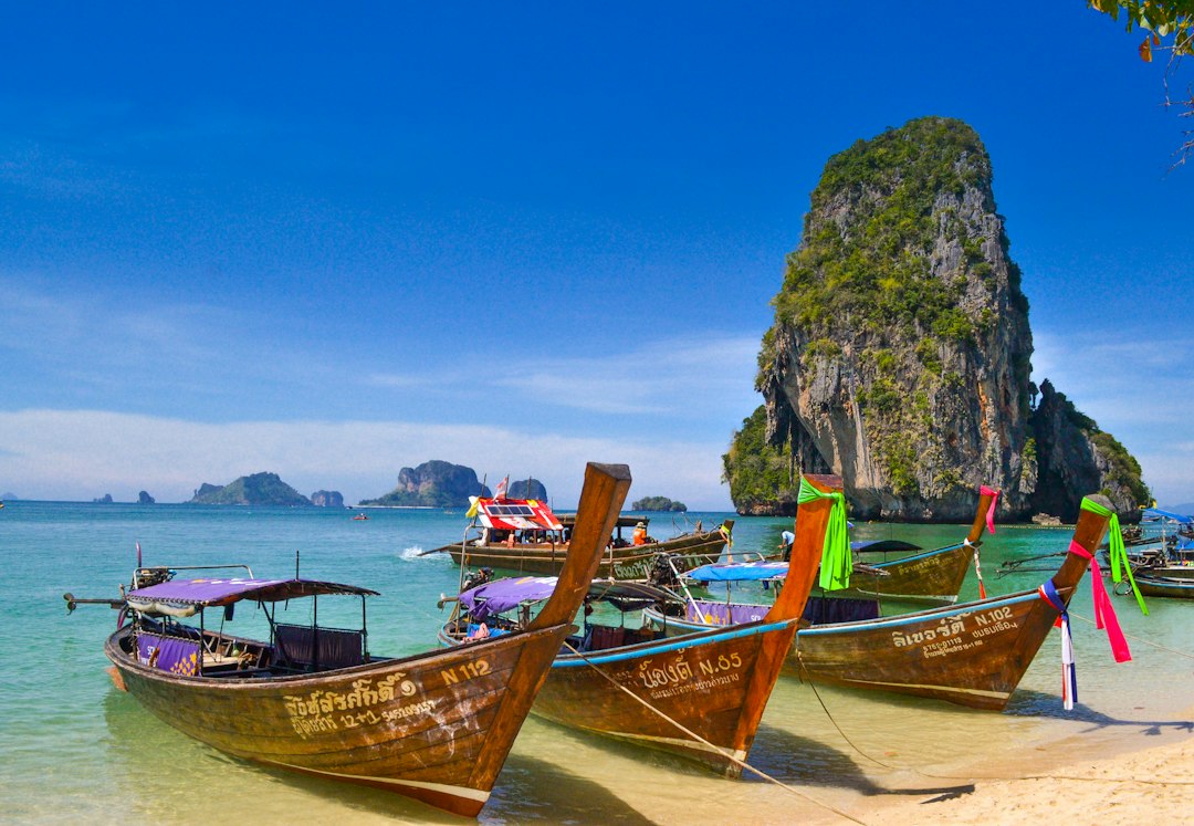 Phuket: five brown wooden boats**